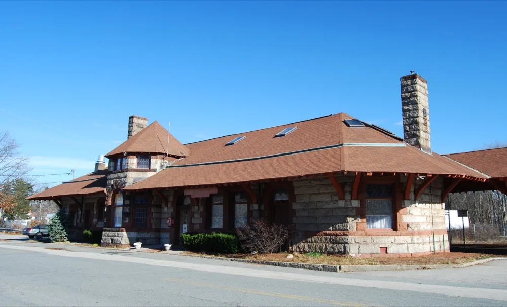 Exterior of the historic granite-and-brownstone North Abington railroad depot, home of The Abington Depot restaurant