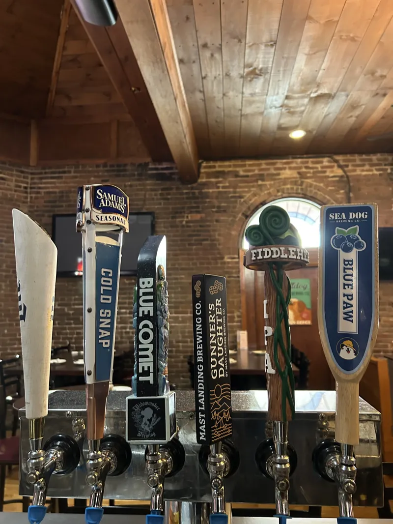 Draft tap handles at the bar including Sam Adams Cold Snap, Widowmaker Blue Comet, Fiddlehead IPA and Sea Dog Blue Paw