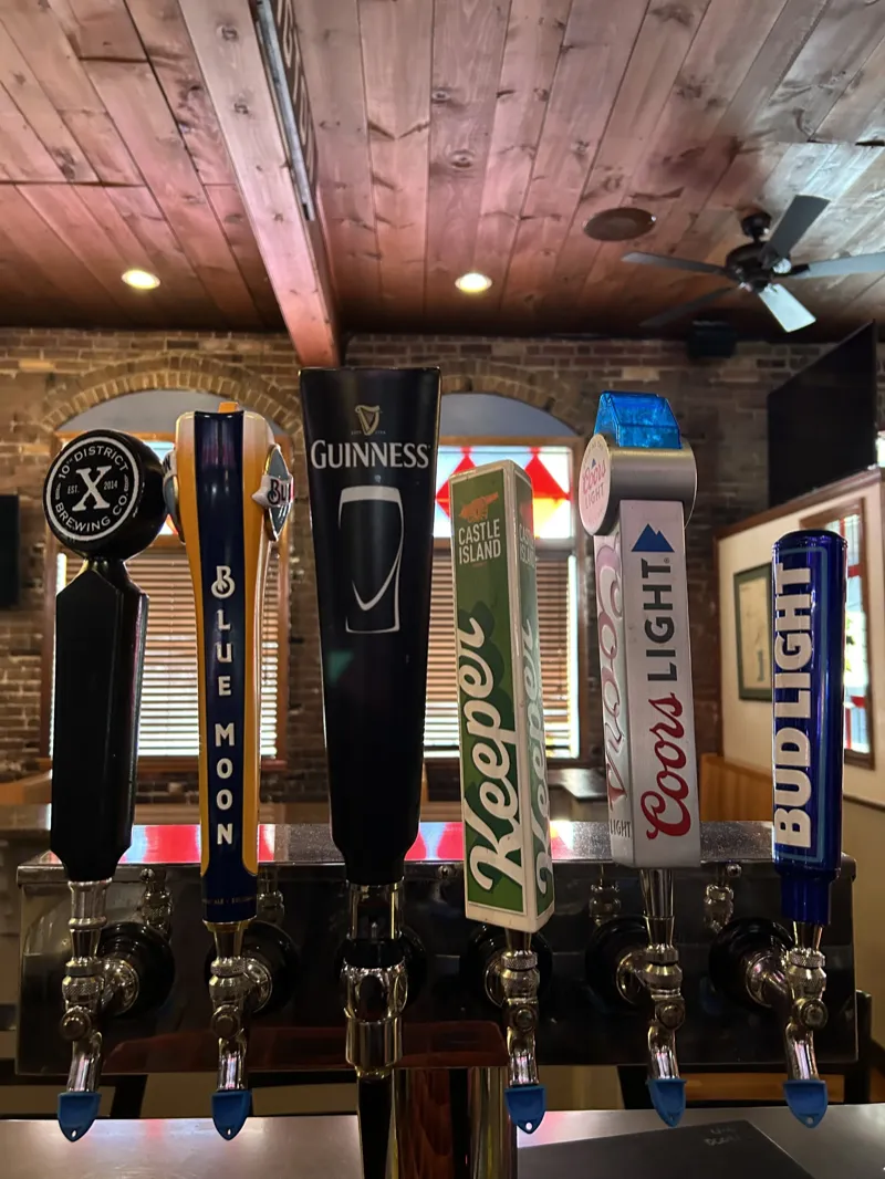 More draft tap handles including 10th District, Blue Moon, Guinness, Castle Island Keeper, Coors Light and Bud Light